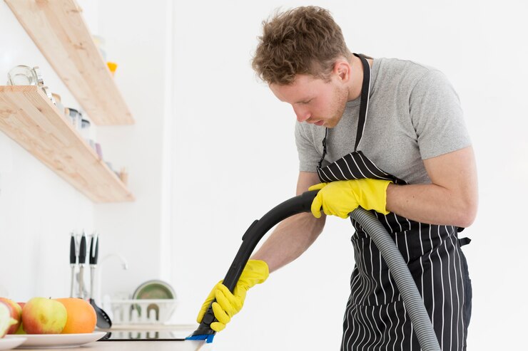 man-with-vacuum-cleaning_23-2148514830